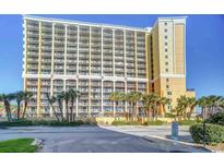 Beautiful multi-story condo building featuring multiple balconies and manicured landscaping at 6900 N Ocean Blvd. # 734, Myrtle Beach, SC 29572