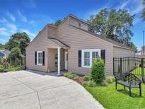 Charming single-story home with a well-maintained lawn, inviting entrance, and a long concrete driveway at 709 Jerdon Circle, North Myrtle Beach, SC 29582