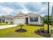 Charming single-story home with manicured lawn, neutral siding, and attached one car garage at 964 Irving Dr., Little River, SC 29566
