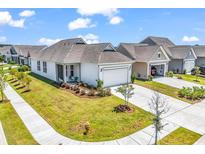 Charming single-story home with a well-manicured lawn and a two-car garage at 1360 Littleleaf Loop, North Myrtle Beach, SC 29582