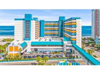 Bright, airy hotel exterior near the beach with an attached covered parking area and walkway at 1501 S Ocean Blvd. # 639, Myrtle Beach, SC 29577