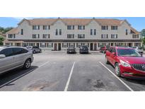 Condominium complex with ample parking spaces on a sunny day, offering convenient access for residents and visitors at 510 Fairwood Lakes Dr. # R-17, Myrtle Beach, SC 29588