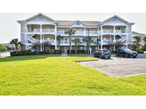 Lovely condo with balconies, beautiful landscaping and parking at 5801 Oyster Catcher Dr. # 832, North Myrtle Beach, SC 29582