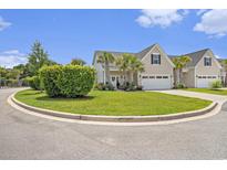 Charming home showcasing beautiful landscaping, manicured lawn, and an attached two-car garage at 800 Monarch Dr. # 49, Myrtle Beach, SC 29588