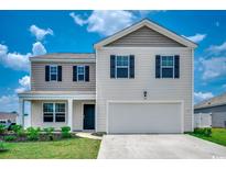 Charming two-story home with a well-manicured lawn and inviting curb appeal at 960 Corn Husk Loop, Conway, SC 29527
