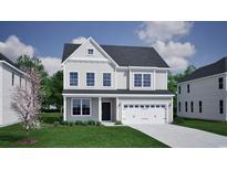 Charming two-story home with a manicured lawn, attached two-car garage, and neutral-toned siding and trim at 1076 Laconic Dr., Myrtle Beach, SC 29588