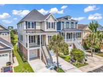 Stunning elevated home with a neutral color palette, manicured landscaping, and convenient garage access at 1112 Whispering Winds Dr., Myrtle Beach, SC 29579