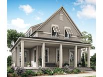 Charming two-story home featuring a welcoming front porch with classic columns and a well-manicured lawn at 1627 Sayebrook Pkwy., Myrtle Beach, SC 29588