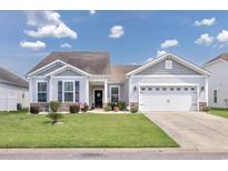 Charming single-story home with a well-maintained lawn, inviting curb appeal, and an attached two car garage at 1725 Boyne Dr., Myrtle Beach, SC 29588
