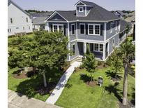 Two-story home with charming curb appeal, landscaped lawn, and inviting walkway at 287 West Palms Dr., Myrtle Beach, SC 29579