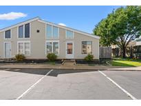 Inviting home featuring unique windows, a well-maintained yard, and reserved parking at 800 9Th Ave. S # N-1, North Myrtle Beach, SC 29582