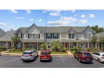 Inviting townhome with manicured landscaping, neutral siding, and convenient parking at 807 Wilshire Ln. # 807, Murrells Inlet, SC 29576