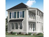 Charming two-story home featuring double porches, blue shutters, and stylish architectural details at 1107 Milford Way, Myrtle Beach, SC 29588