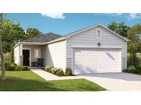 Charming single-story home with a manicured lawn and a two-car garage is well-lit by the sun at 164 Warner Crossing Way, Loris, SC 29569