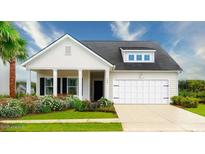 Charming single-Gathering home featuring a well-manicured lawn and inviting front porch with white pillars at 3342 Wood Stork Dr., Ocean Isle Beach, NC 28469
