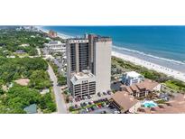 An aerial view shows a high-rise building with ocean views and a beautiful beach at 5523 N Ocean Blvd. # 1412, Myrtle Beach, SC 29577