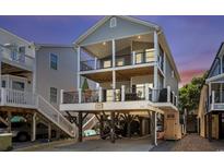 Two-story coastal home featuring dual balconies and covered parking at 6001-1010 S Kings Highway, Myrtle Beach, SC 29575