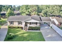 Charming single-story brick home with a well-maintained lawn and an inviting front porch at 616 Mckinley Way, Conway, SC 29526