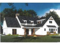 Charming white home with a stone-accented porch and a dark, shingled roof at Lot 142 Millbank Rd., Georgetown, SC 29440