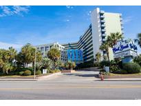 A view of the resort's main entrance and landscaping at 1105 S Ocean Blvd. # 128, Myrtle Beach, SC 29577