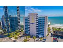 Oceanfront condo building featuring a unique sailboat logo and balcony views of the Atlantic Ocean at 1304 N Ocean Blvd. # 1000, Myrtle Beach, SC 29577