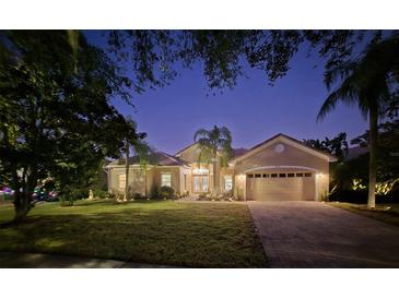 Stunning single-story home with a two-car garage and beautifully landscaped lawn at 2621 Lookout, Kissimmee, FL 34746