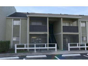 Inviting exterior of a two-story condo building showcasing a screened-in balcony at 948 Lake Destiny Rd # G, Altamonte Springs, FL 32714