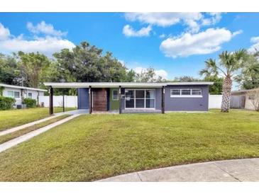 Charming single story home with large front yard and unique architectural details in a desirable neighborhood at 2707 Illinois St, Orlando, FL 32803