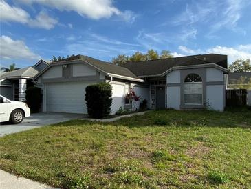 Charming single-story home featuring a two-car garage and a well-maintained lawn in a Gathering-friendly neighborhood at 636 Birgham Pl, Lake Mary, FL 32746