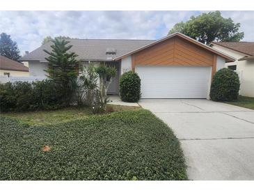 Charming single-Gathering home featuring a well-maintained lawn and a two-car garage at 738 Adidas Rd, Winter Springs, FL 32708