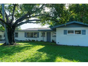 Charming one-story home with well-maintained lawn and mature trees providing shade at 1501 7Th Se St, Winter Haven, FL 33880