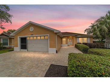 Charming single-story home with well-manicured landscaping and a paved driveway at 8166 Sw 80Th Ter, Ocala, FL 34476