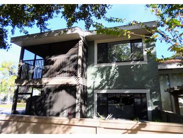 Two-story exterior with a balcony and neutral tones, offering a welcoming curb appeal at 5127 Eaglesmere Dr # A02, Orlando, FL 32819
