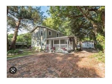 Charming two-story home with mature trees and large front yard at 2508 Yale Ave, Sanford, FL 32773