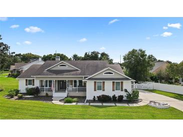 Beautiful ranch home with a large front porch and well-manicured lawn at 2375 Miles Ct, Lakeland, FL 33812