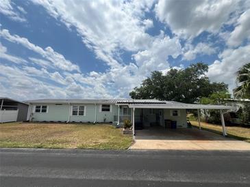 Charming single-story home with a covered carport and well-maintained lawn at 2055 S Floral Ave # 262, Bartow, FL 33830