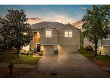 Charming two-story home with a well-manicured lawn, a two-car garage, and inviting curb appeal at 3334 Fawnwood Dr, Ocoee, FL 34761