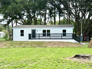 Charming single-story home with a spacious front yard and inviting front porch at 6611 Glen Meadow Loop, Lakeland, FL 33810