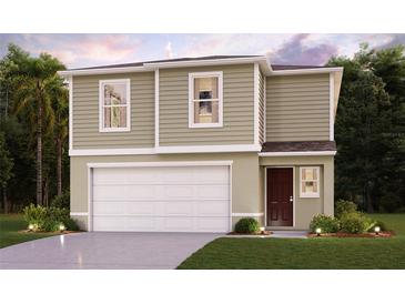 Two-story house with a neutral color scheme, two-car garage, and landscaping at 1005 Ambleside Dr, Haines City, FL 33844