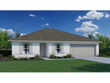 Single-story home with a two-car garage and landscaped lawn at 6911 Sw 151St Pl, Ocala, FL 34473