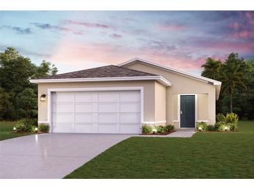 Charming one-story home with a two-car garage, well-manicured lawn, and inviting curb appeal at 2012 Golden Beak Dr, Eagle Lake, FL 33839