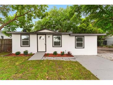 Charming single-story home with a well-manicured lawn and fresh landscaping, creating inviting curb appeal at 760 S Park Ave, Winter Garden, FL 34787