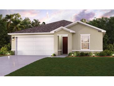 Charming single-story home boasts a two-car garage, well-manicured lawn, and inviting curb appeal at 2323 Oklahoma Dr, Sumterville, FL 33585
