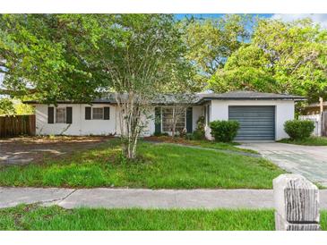 Charming single-story home with a lush front yard and attached one car garage at 1586 Fergason Ave, Deltona, FL 32725