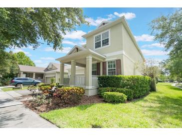 Charming two-story home with a welcoming front porch and well-manicured landscaping at 3221 Dark Sky Dr, Harmony, FL 34773