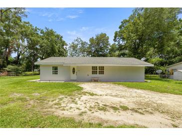 Charming single-story home with a well-maintained lawn and inviting front entrance at 1143 Ne 23Rd St, Ocala, FL 34470