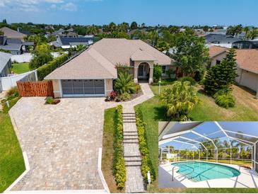 Aerial view of single-Gathering home with pool and landscaped yard at 3 Seabridge Dr, Ormond Beach, FL 32176