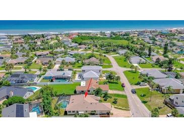Expansive aerial view showcasing a lovely single Gathering home with a pool and close proximity to beach at 3 Seabridge Dr, Ormond Beach, FL 32176