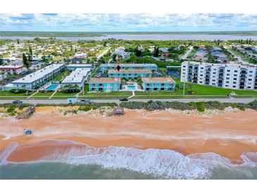 Beachfront condo complex with ocean views and a community pool, near the Intracoastal waterway at 2850 Ocean Shore Blvd # 15C, Ormond Beach, FL 32176