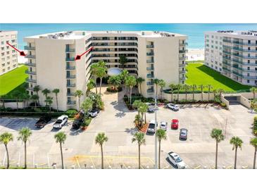 Oceanfront building with parking and lush landscaping at 4565 S Atlantic Ave # 5601, Port Orange, FL 32127